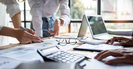 business people meeting in the office Calculate the tax and income of the company's investment. Strategic Planning and Brainstorming colleague concept, report, analyze graph plans
