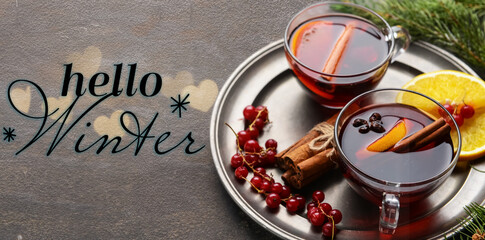 Banner with tasty mulled wine and text HELLO WINTER on grunge background © Pixel-Shot