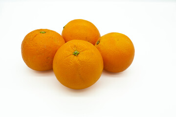 fresh oranges on a white background. Close-up shot of oranges from above. Vitamin C source, diet and vegan diet. Banner