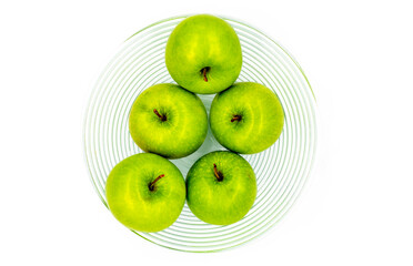 a basket of green apples on a white background. Healthy foods and diet foods. Fruits and healthy eating. Green apples, source of health and flavor