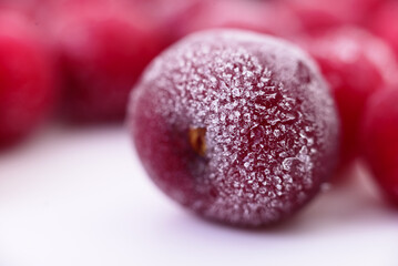 Group of frozen cherries.