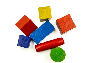 colorful geometric shapes, wooden figures on a white background