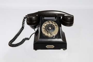 Old telephone isolated white background