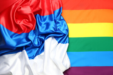 Flags of LGBT and Russia as background, closeup