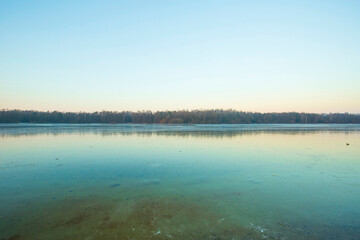 sunset on a frozen lake. Frozen lakes and winter landscapes. Backgrounds and wallpapers.