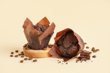 Tasty chocolate muffins on color background