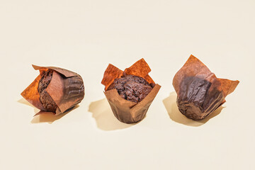 Tasty chocolate muffins on color background