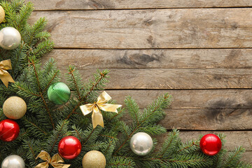 Fototapeta na wymiar Beautiful Christmas composition with fir branches and decorations on wooden background