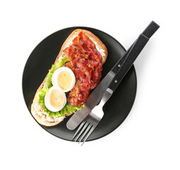 Plate of tasty toast with boiled egg and fried bacon on white background