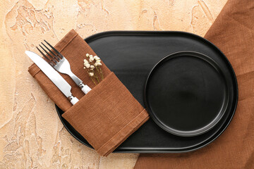 Stylish table setting with black plates on color table