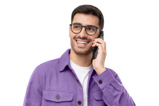 Handsome young man in casual purple shirt and trendy glasses talking on the phone, smiling and looking away