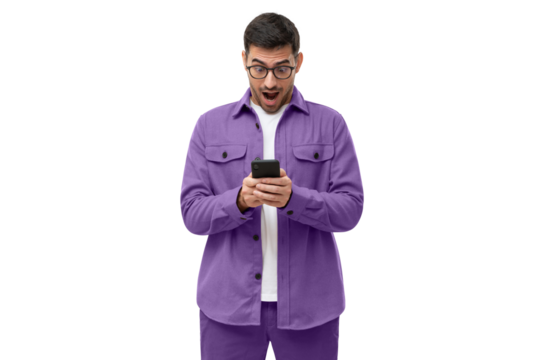 Surprised young man in purple shirt looking at his smartphone with amazed facial expression, shocked by new online app