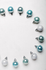 Composition with different Christmas balls on light background, closeup