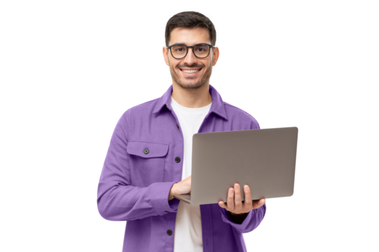 Studio portrait of young man standing holding laptop and looking at camera with happy smile