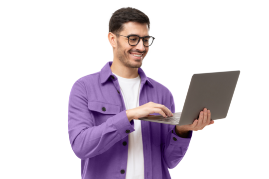 Young modern businessman wearing casual shirt, standing with open laptop in hands, surfing online
