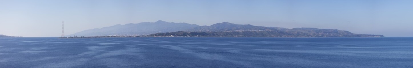 Fototapeta na wymiar City by the Sea. Messina, Sicilia, Italy. Sunny Morning. Panoramic View.