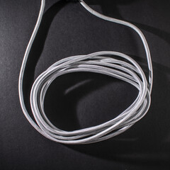 Grey Braided Cable on Black Background
