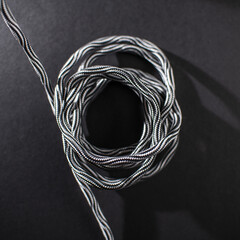 Black and White Braided Cable on Black Background