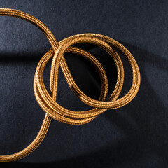 Gold Braided Cable on Black Background