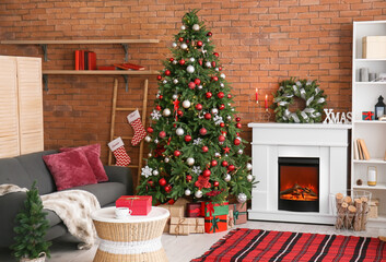 Interior of living room with fireplace, Christmas wreath and fir tree