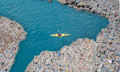Concept pollution garbage plastic ocean. Aerial top view Kayak boat turquoise blue water sea