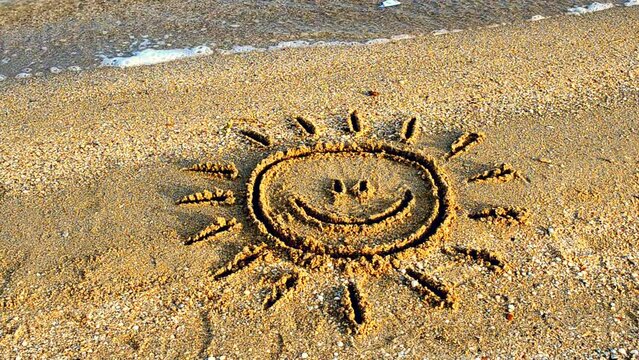 Sun drawing on the beach. Beach and drawing.