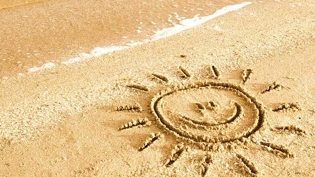 Sun drawing on the beach. Beach and drawing.