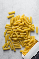 Flat lay of uncooked tortiglioni pasta shells, top view of tortiglioni pasta shells, dry uncooked...