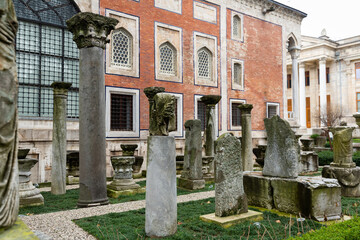 Architectural elements, parts of columns, bas-reliefs and sculptures displayed outdoors near...
