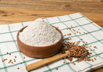 Buckwheat Flour Pile in Wood Bowl, Dry Buck Wheat Powder, Buckwheat Flour on Wooden Rustic Background