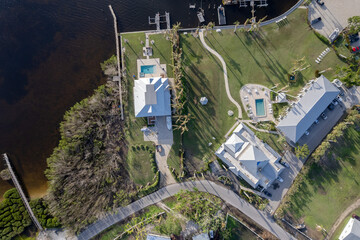 Hurricane Ian destroyed homes in Florida residential area on golf course. Natural disaster and its consequences