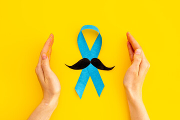 November prostate cancer awareness ribbon with a paper mustache