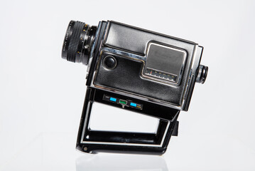 8mm Movie Camera. Vintage old video camera isolated on white