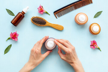 Set of hair care cosmetic products with flowers