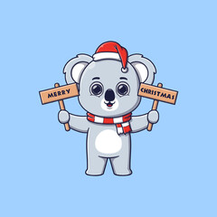 cute koala holding wooden board with christmas greetings © noriweuhcs