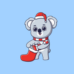 cute koala putting gift box in christmas sock