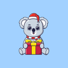 cute koala sitting and holding big gift box