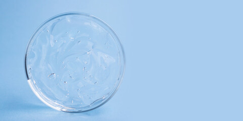 Closeup photography of cosmetics gel with bubbly structure in the petri dish.Cosmetics large banner with copy space.