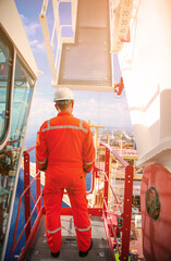 Offshore oil and gas industry and operated by technician petroleum. Worker walking to oil and gas...