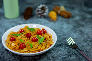Pasta with eggs and tomatoes sauce italian traditional sprinkle with basil organic and tomato fresh is my breakfast menu for today.
