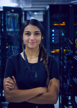 Portrait of smiling female technician in server room