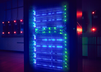 Glowing hard drives in dark server room