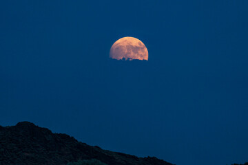USA, Idaho, bellevue, Full moon rising over mountain
