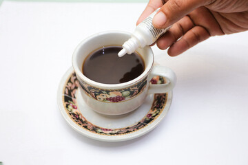 black coffee.  added safe artificial sweeteners for diabetics containing sucrose, fructose, glucose.  artificial sweetener in the form of liquid sugar. - obrazy, fototapety, plakaty