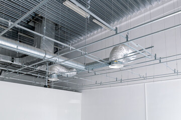 Ventilation and air conditioning system on the ceiling of an industrial building, metal ventilation...