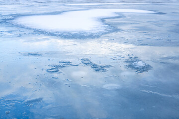 Christmas blue background with a frozen pattern. Empty space for text, wet ice
