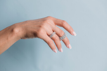 hands of a woman. Jewel. Sensual woman hand. Love. Background. Cream. Hand. 