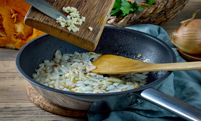 fresh chopped garlic is added to fried onions
