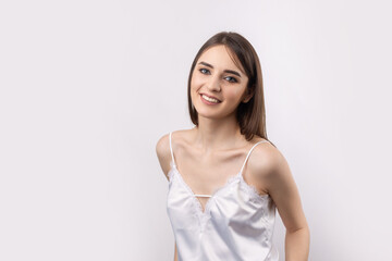 Obraz premium Beautiful smiling woman with clean skin, natural make-up and white teeth on a gray background