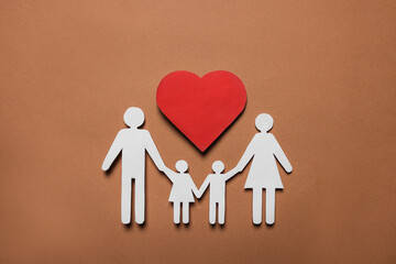 Paper family figures and red heart on brown background, flat lay. Insurance concept